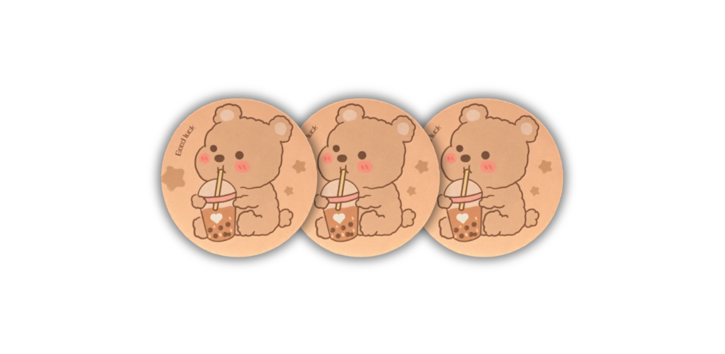 Boba Bear Coaster 3-Pack, featuring irresistibly cute light brown bears with pink cheeks, each enjoying a delicious cup of boba. Perfect for adding charm and fun to your space.