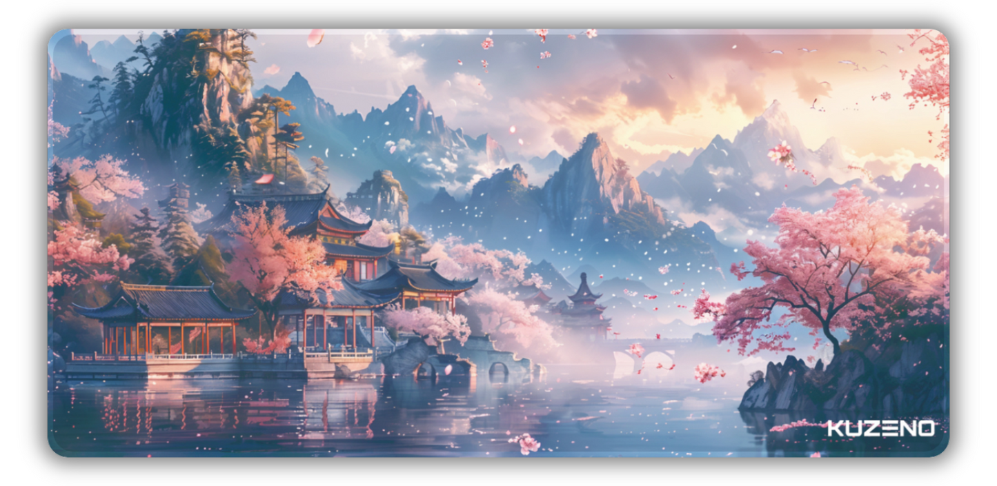 Petal Paradise gaming mousepad featuring a tranquil landscape with cherry blossoms and a pagoda, set against majestic mountains, creating a peaceful and serene atmosphere.