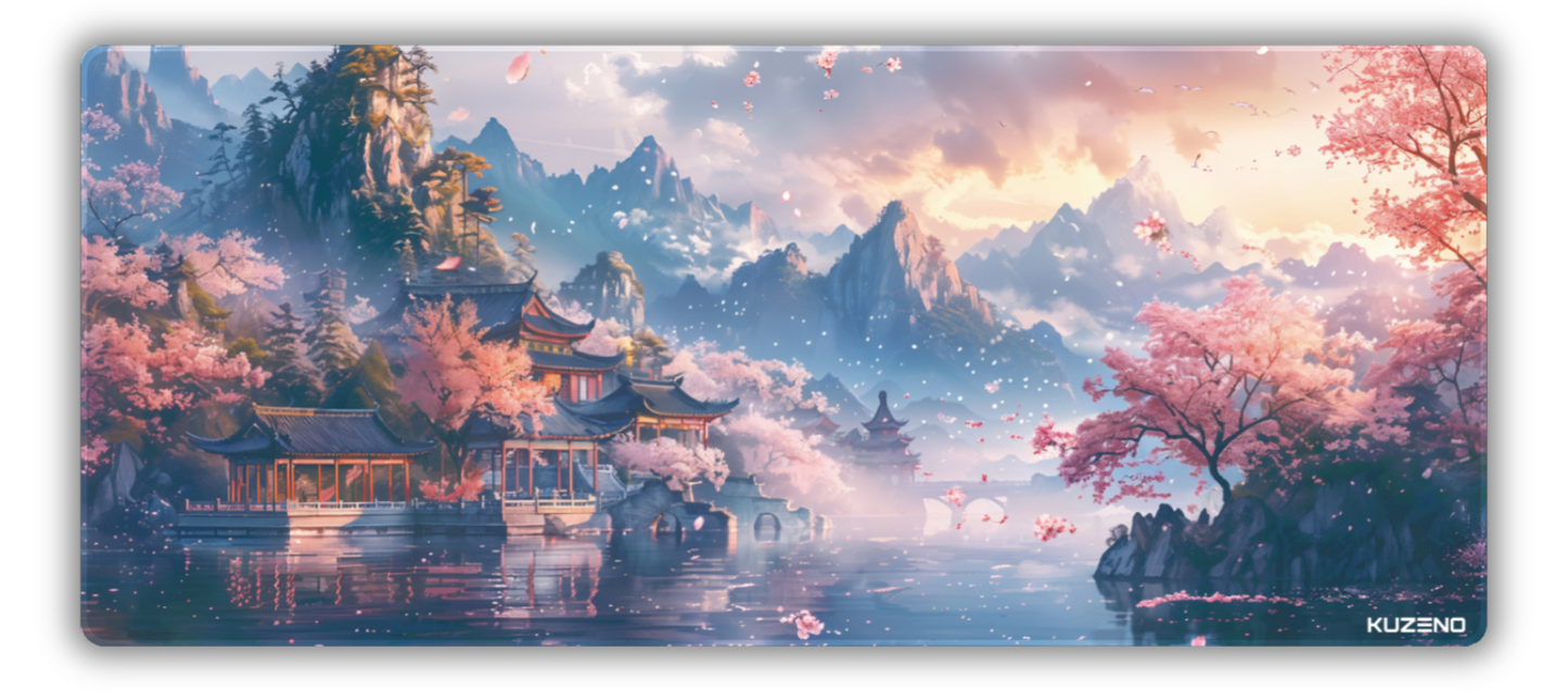 Petal Paradise gaming mousepad featuring a tranquil landscape with cherry blossoms and a pagoda, set against majestic mountains, creating a peaceful and serene atmosphere.