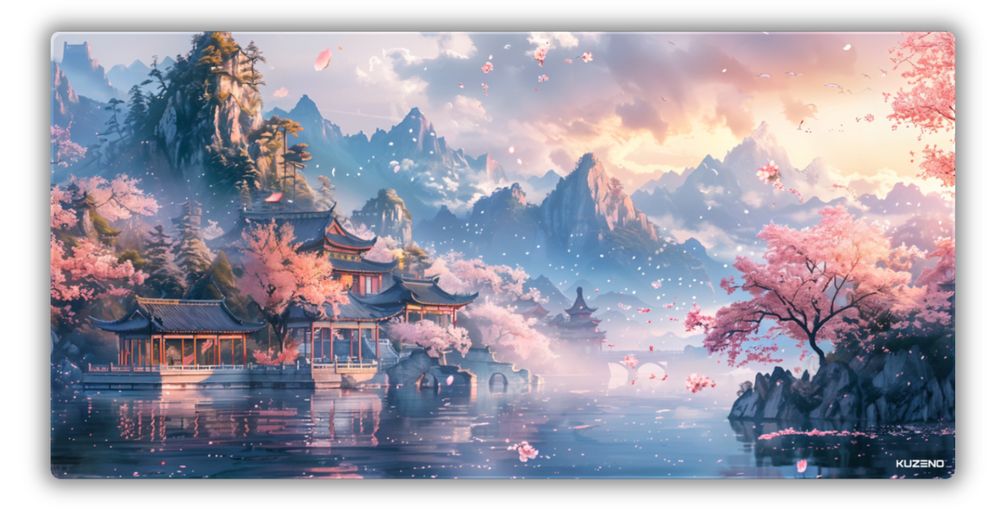 Petal Paradise gaming mousepad featuring a tranquil landscape with cherry blossoms and a pagoda, set against majestic mountains, creating a peaceful and serene atmosphere.